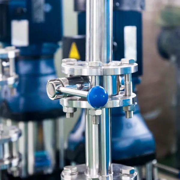 Close view of blue-handled valves on industrial machinery